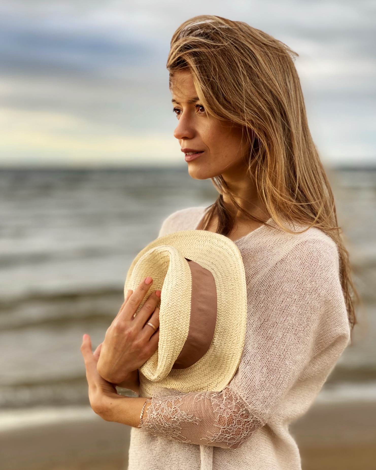 A beach portrait in soft, even light that flatters the face.
