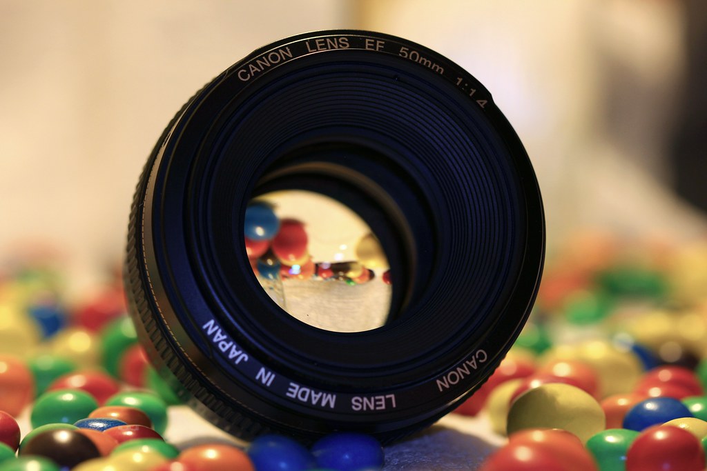 A camera dial showing aperture and shutter speed settings, photographed in soft window light.